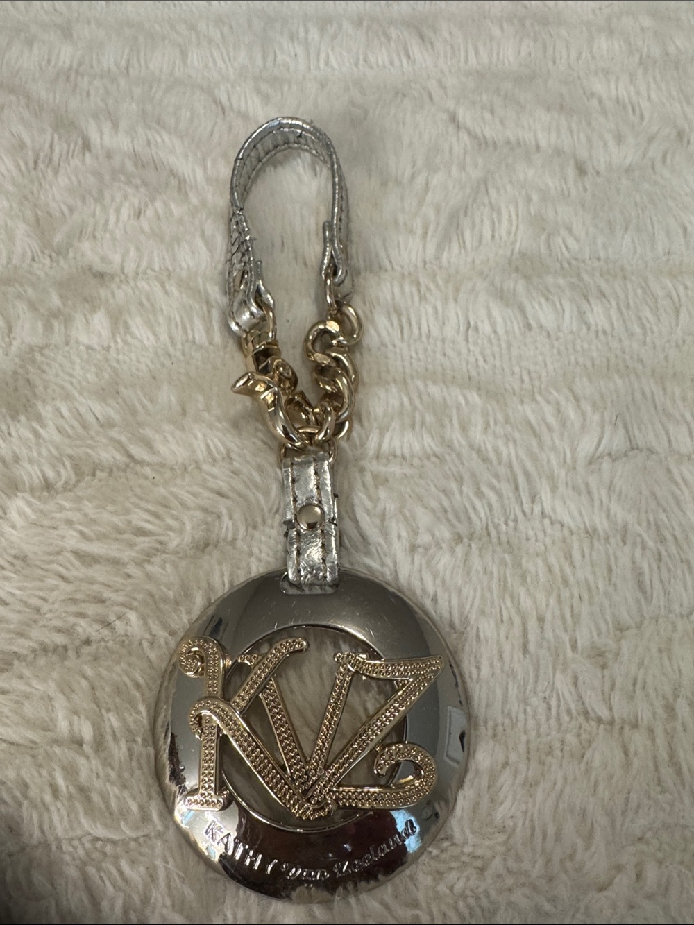 Kathy Van Zeeland Silver and Gold Metallic Logo Key Chain